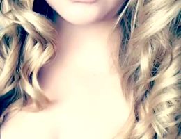 Teasing With Long Curls And Glasses